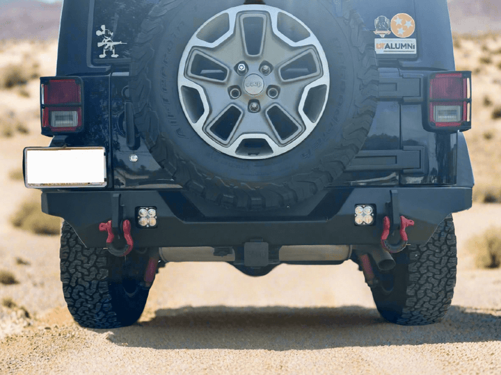 Jeep Wrangler with aftermarket bumper and spare tire