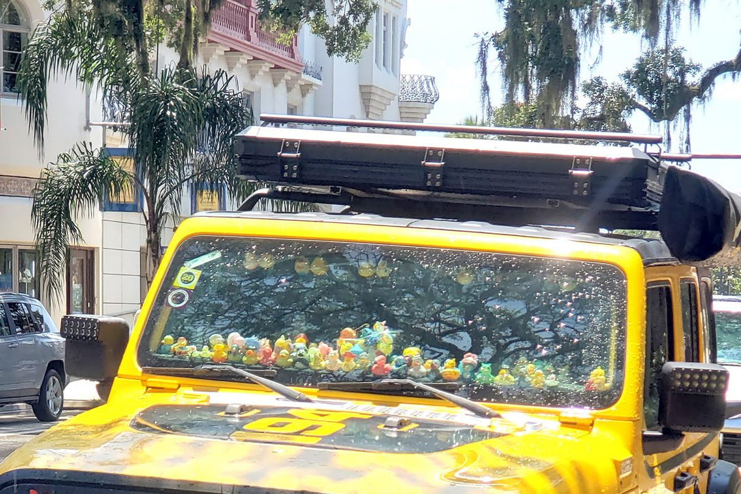 A yellow Jeep with a dashboard full of rubber ducks prompts the question: ‘What does getting ducked mean for Jeep owners?