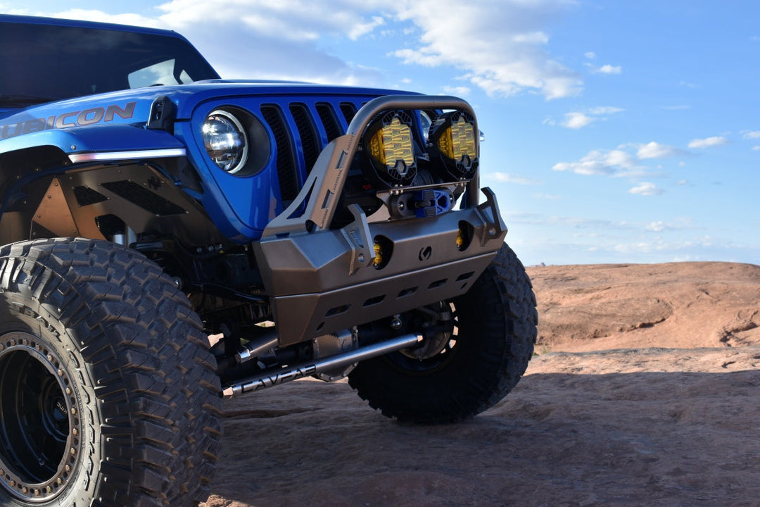 blue Jeep Wrangler Rubicon on a rocky trail showing the jeep wrangler vs rubicon difference
